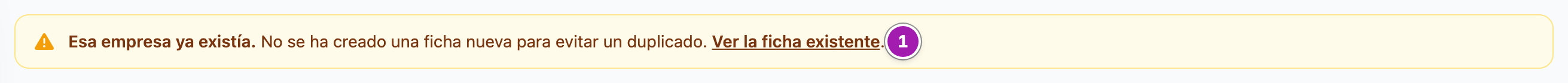 Aviso ámbar arriba del listado de empresas: «Esa empresa ya existía. No se ha creado una ficha nueva para evitar un duplicado.», con el enlace «Ver la ficha existente» (1).